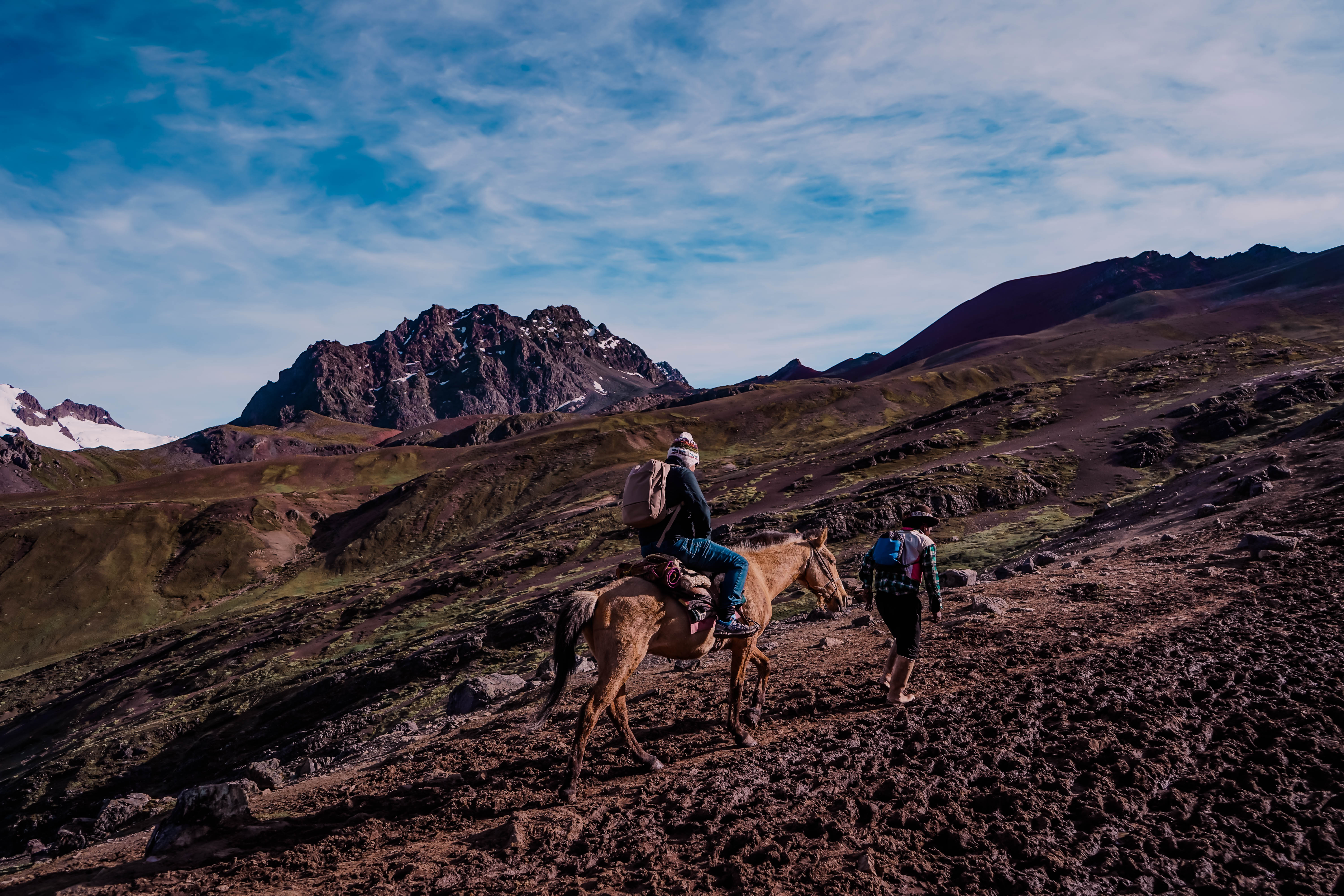 riding-horse-up-rainbow-mountain